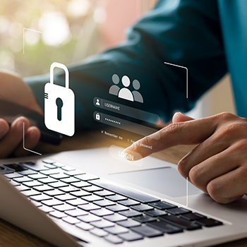 Hands using a laptop as graphics of a login screen and a padlock float above the keyboard.